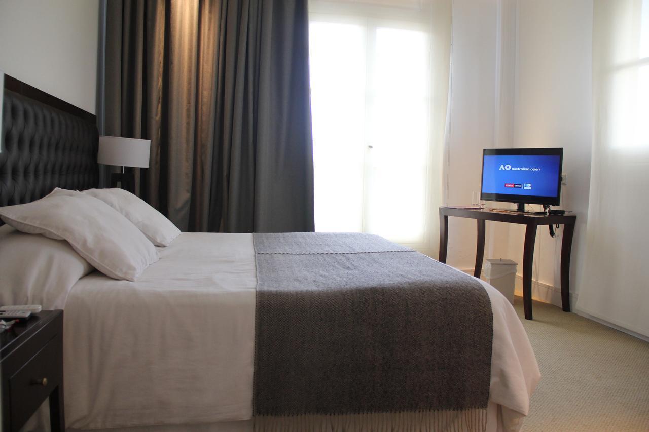 Real Hotel Lujan Bagian luar foto