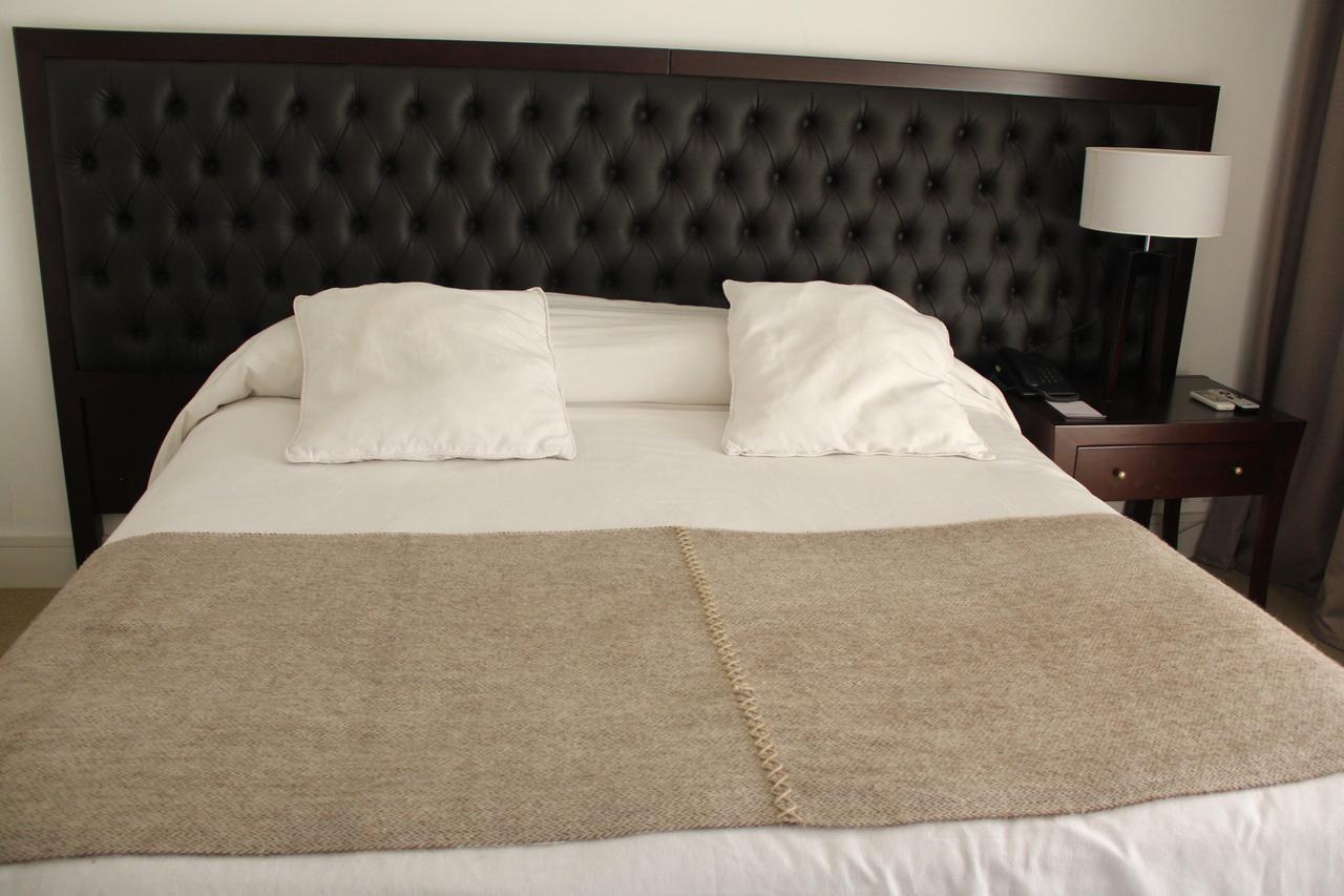 Real Hotel Lujan Bagian luar foto