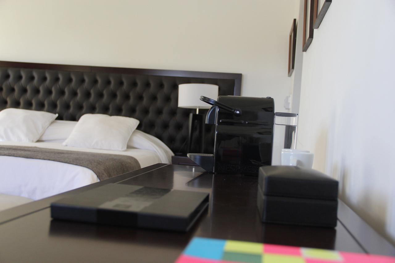 Real Hotel Lujan Bagian luar foto