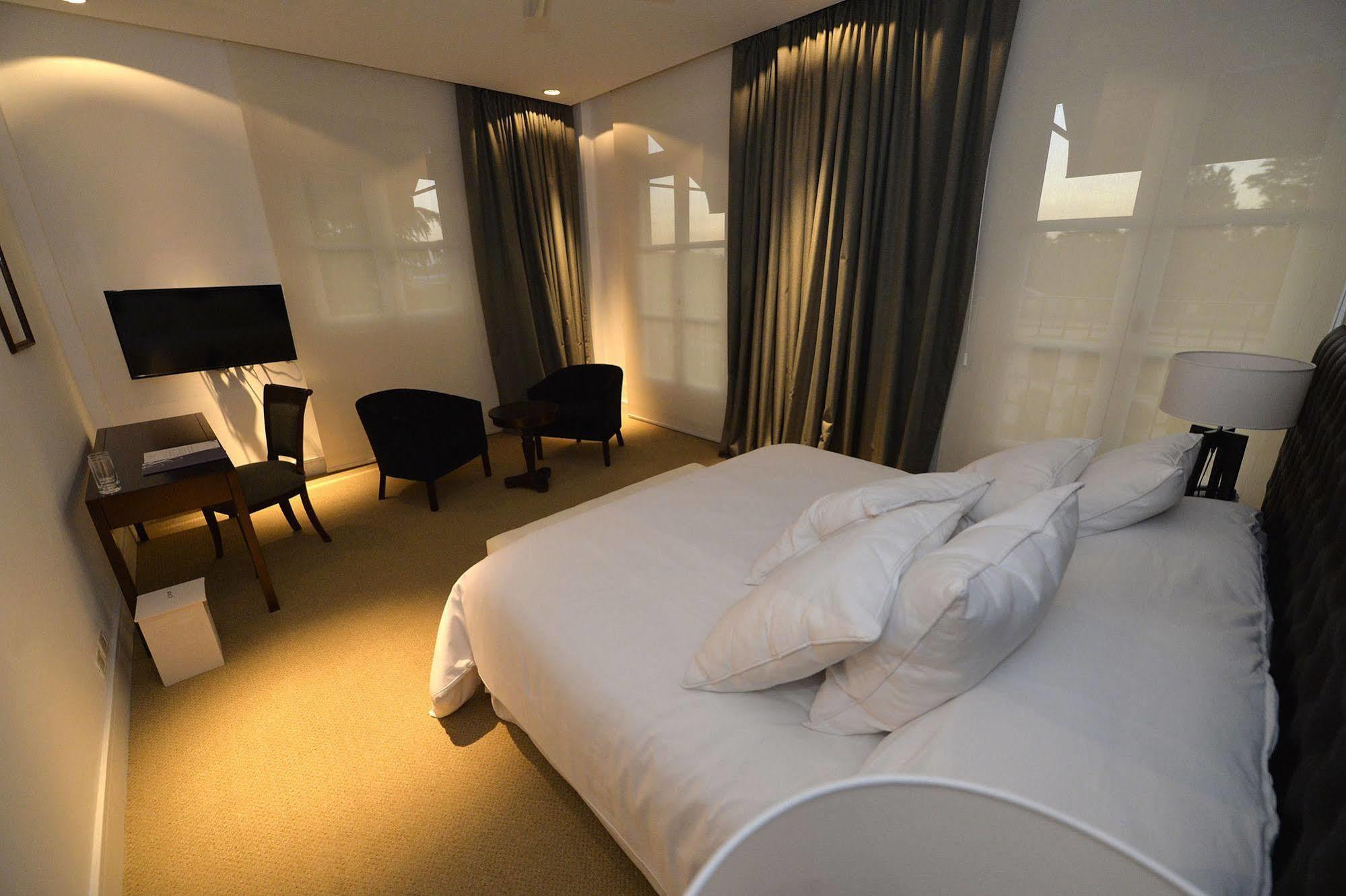 Real Hotel Lujan Bagian luar foto